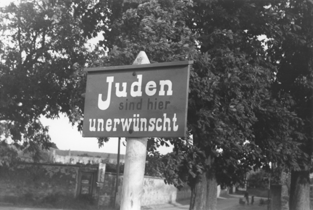 An anti-Jewish sign posted on a street in Bavaria reads "Jews are not wanted here." Germany, 1937 - USHMM